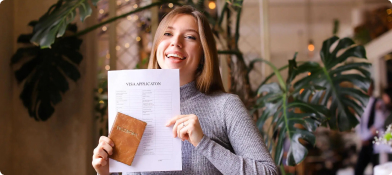 Happy visa applicant holding approval documents, trusted guidance by Starc Migration Agent Melbourne